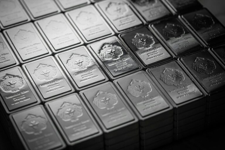 A pile of silver bars sitting on top of a table